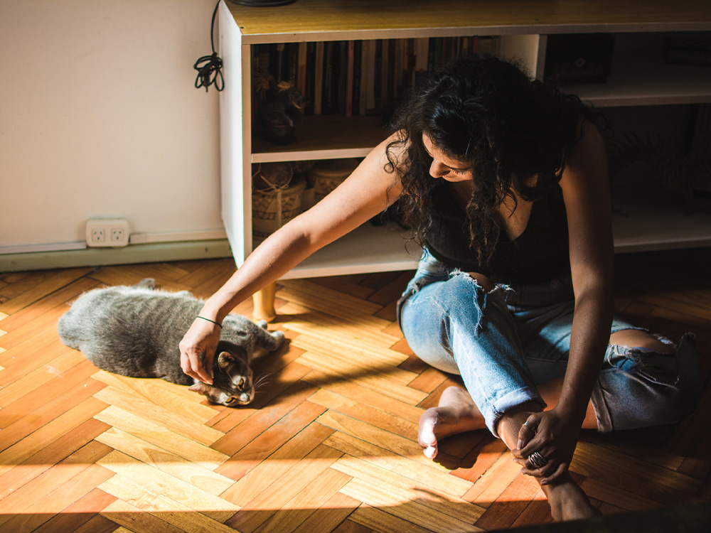 woman approaching a new cat