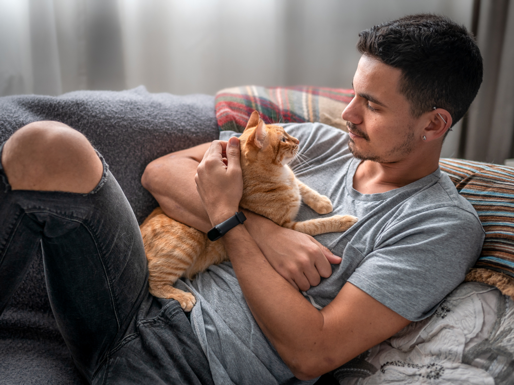 Man holding newly adopted cat