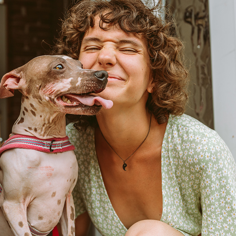 Woman smiling with ugly hairless dog breed