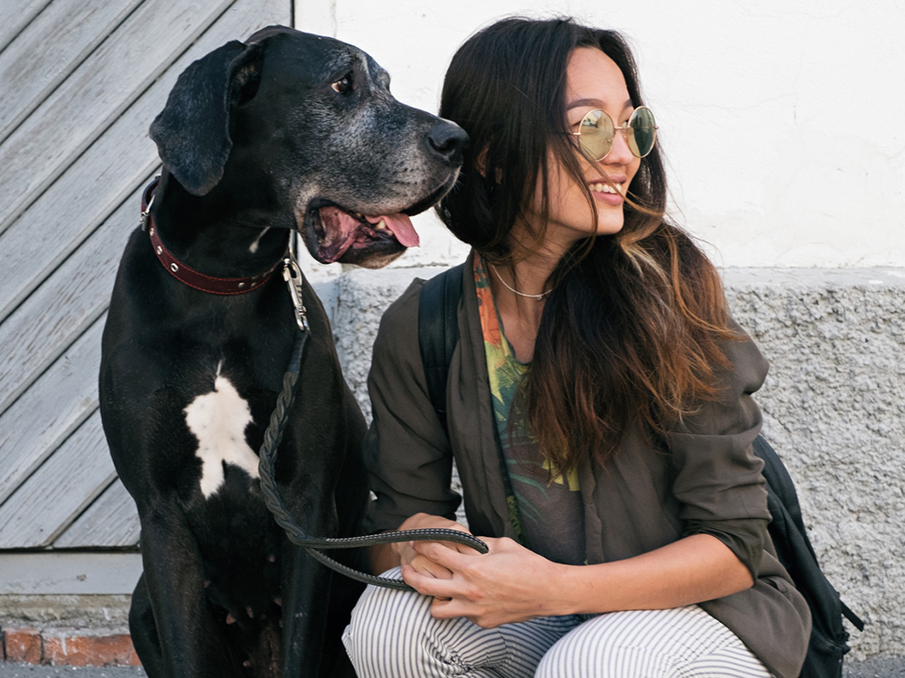 asian woman with black giant great dane