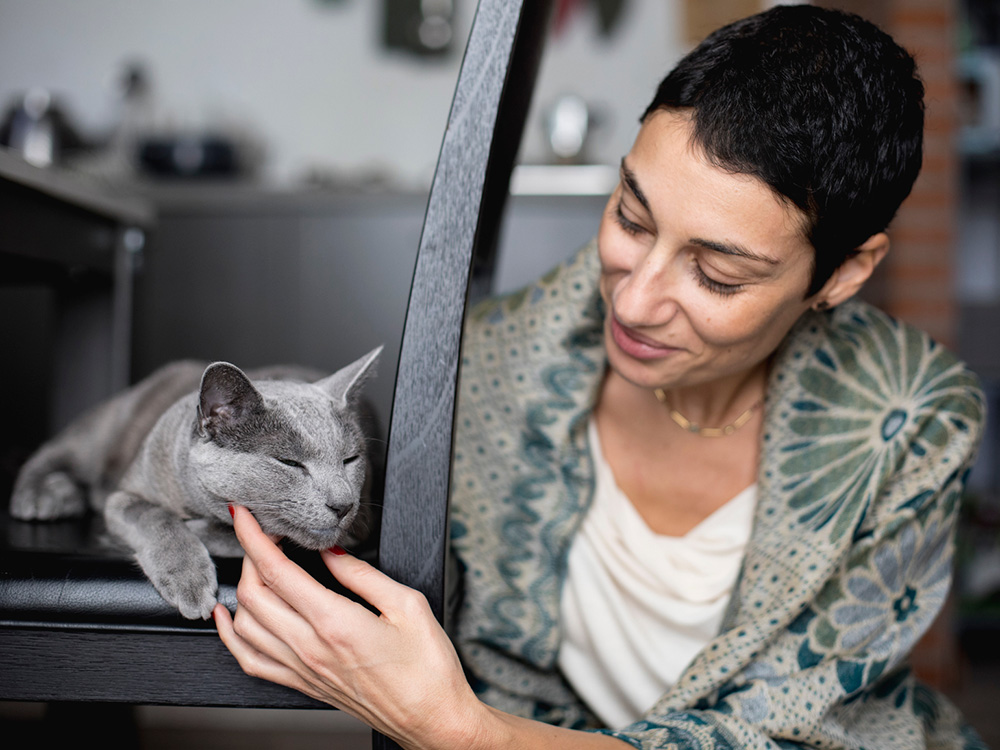 Woman wondering if she should adopt a cat