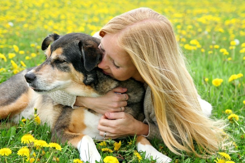 A woman hugging a dog