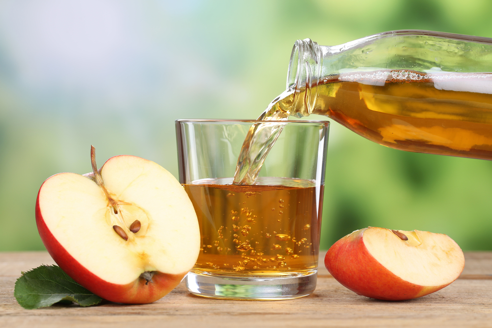 Apple juice poured from bottle