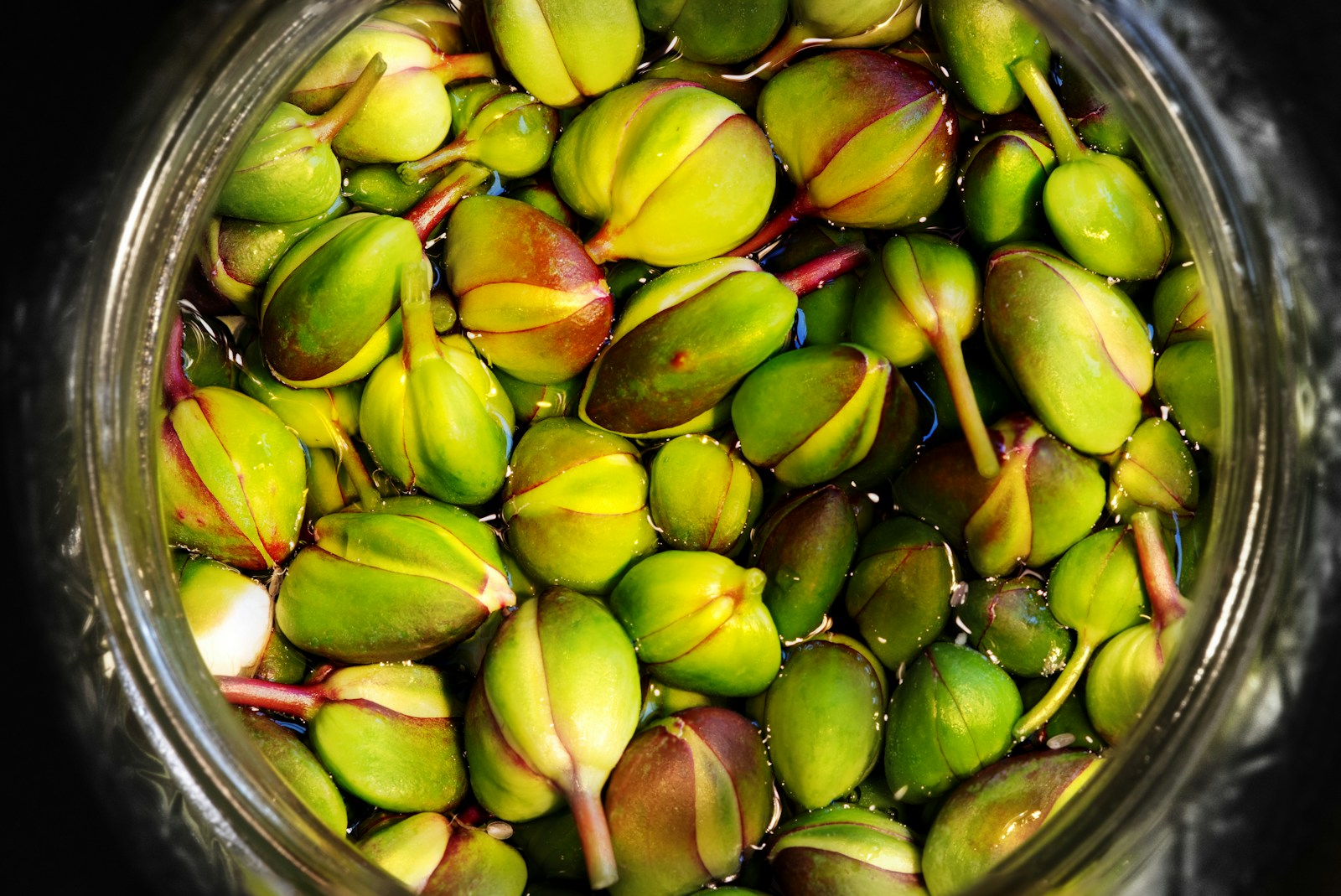 Capers fruit on clear glass bowl